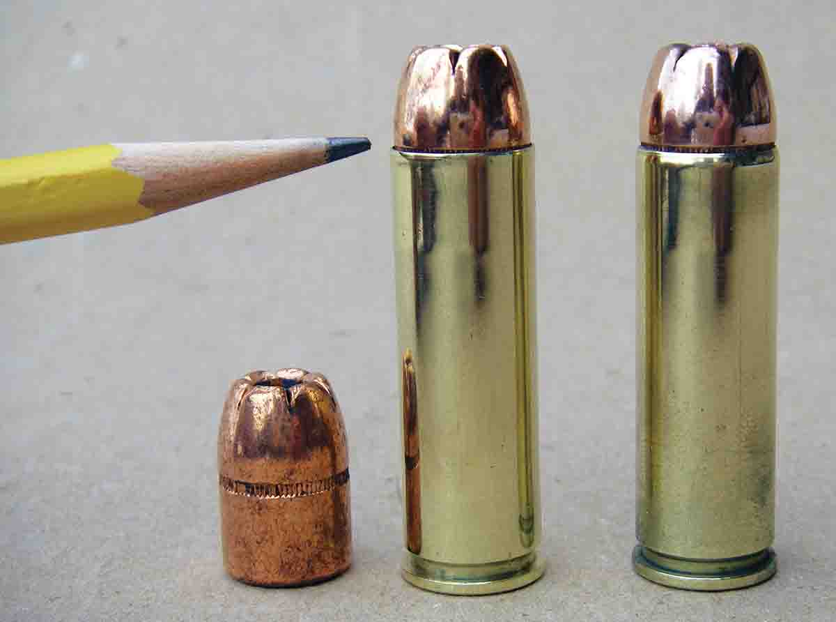 A heavy crimp is needed for the .500 S&W Magnum to obtain reliable ignition and prevent bullets from “walking.” The cartridge at left has a bullet seated with the case mouth level with the upper edge of the cannelure, but has not been crimped. The cartridge at right has a heavy roll crimp, which has been applied as a separate step after the bullet is seated to the correct depth.